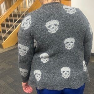 A cardigan and a sweater